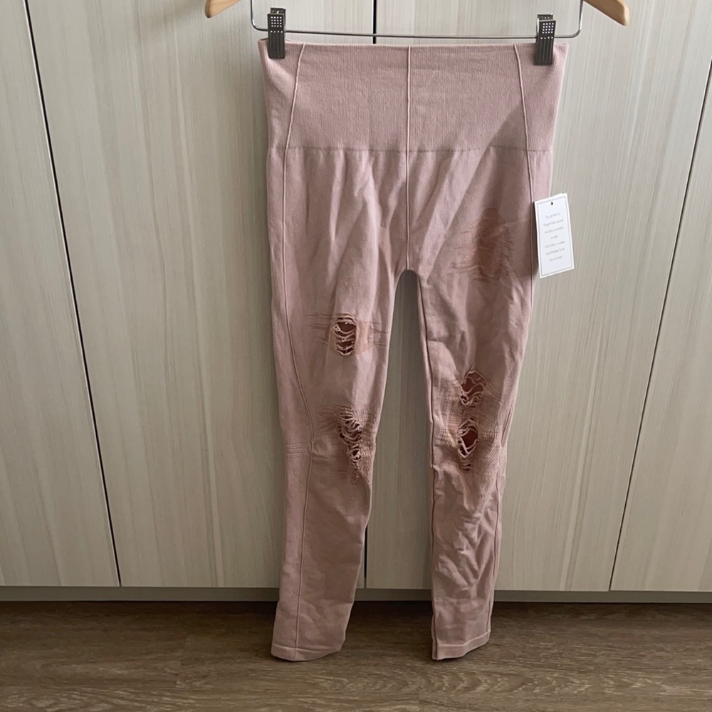 Distressed pink leggings